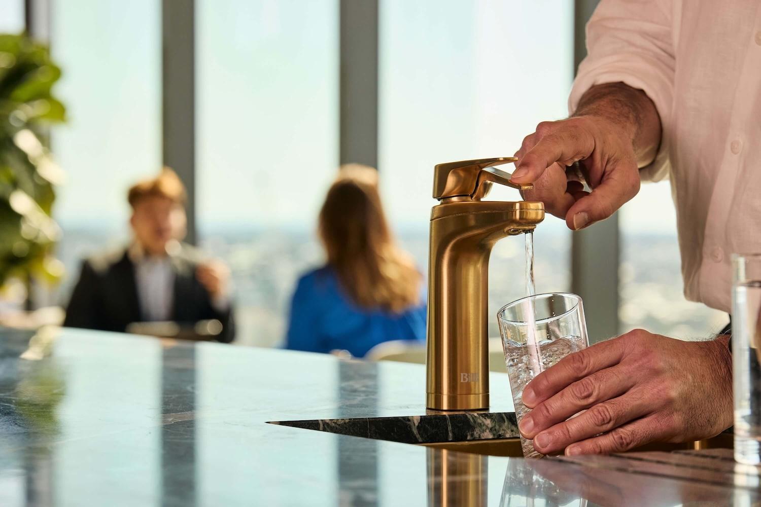 Person using Billi filtered water tap